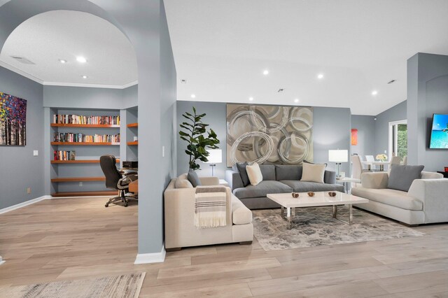 10393 Lexington Cir S, Boynton Beach, FL 33436 - living area with light wood-type flooring, arched walkways, recessed lighting, built in features, and baseboards