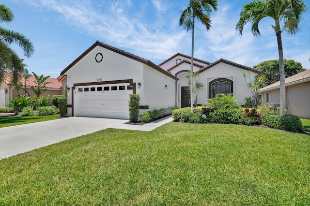 10393 Lexington Cir S, Boynton Beach, FL 33436 - view of front of house with an attached garage, stucco siding, concrete driveway, and a front lawn