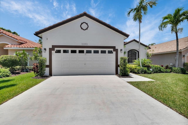 10393 Lexington Cir S, Boynton Beach, FL 33436 - view of front facade with stucco siding, a front yard, driveway, and a garage