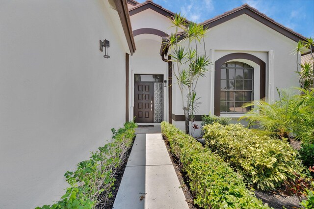 10393 Lexington Cir S, Boynton Beach, FL 33436 - property entrance with stucco siding
