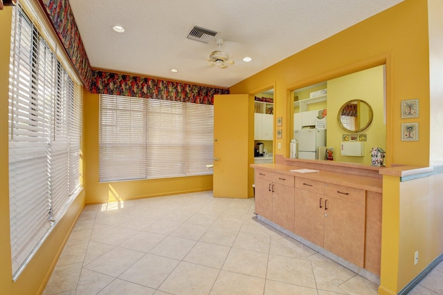 10393 Lexington Cir S, Boynton Beach, FL 33436 - unfurnished bedroom featuring freestanding refrigerator, light tile patterned flooring, and recessed lighting