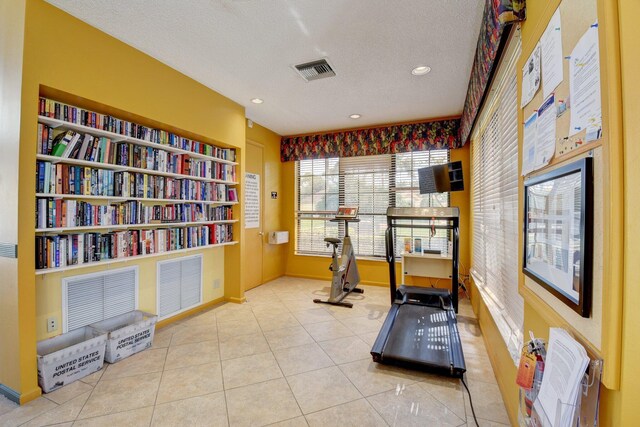 10393 Lexington Cir S, Boynton Beach, FL 33436 - exercise area with a textured ceiling, tile patterned floors, recessed lighting, and baseboards