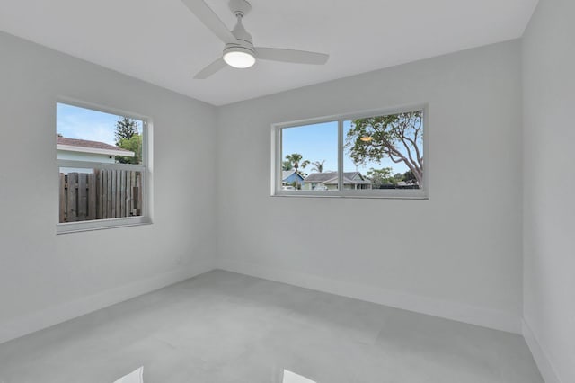 5305 Cleveland Rd, Delray Beach, FL 33484 - spare room featuring healthy amount of natural light, baseboards, and ceiling fan