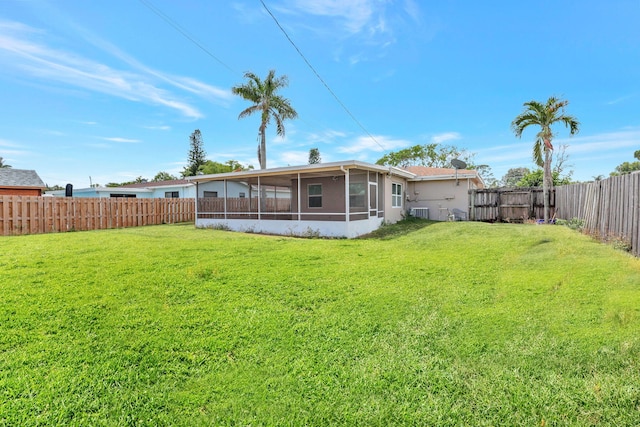 5305 Cleveland Rd, Delray Beach, FL 33484 - back of house featuring a sunroom