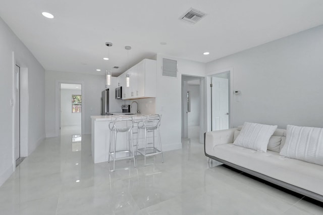 5305 Cleveland Rd, Delray Beach, FL 33484 - living room featuring recessed lighting, baseboards, and light tile patterned floors