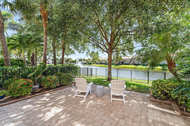 4608 Cadiz Cir, Palm Beach Gardens, FL 33418 - view of patio / terrace with a water view