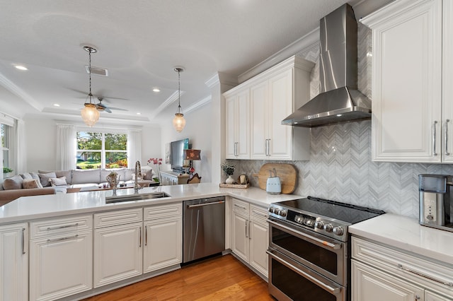 4608 Cadiz Cir, Palm Beach Gardens, FL 33418 - kitchen with appliances with stainless steel finishes, wall chimney range hood, a sink, open floor plan, and ceiling fan