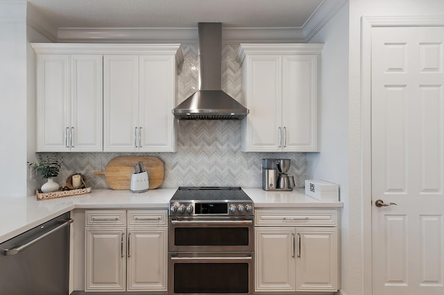 4608 Cadiz Cir, Palm Beach Gardens, FL 33418 - kitchen with appliances with stainless steel finishes, wall chimney range hood, light countertops, backsplash, and crown molding