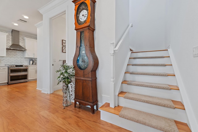 4608 Cadiz Cir, Palm Beach Gardens, FL 33418 - stairway with wood finished floors, recessed lighting, and baseboards