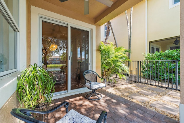 4608 Cadiz Cir, Palm Beach Gardens, FL 33418 - entrance to property with ceiling fan and stucco siding