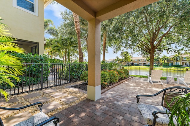 4608 Cadiz Cir, Palm Beach Gardens, FL 33418 - view of patio / terrace with a water view