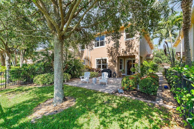 4608 Cadiz Cir, Palm Beach Gardens, FL 33418 - rear view of property featuring a patio area and stucco siding
