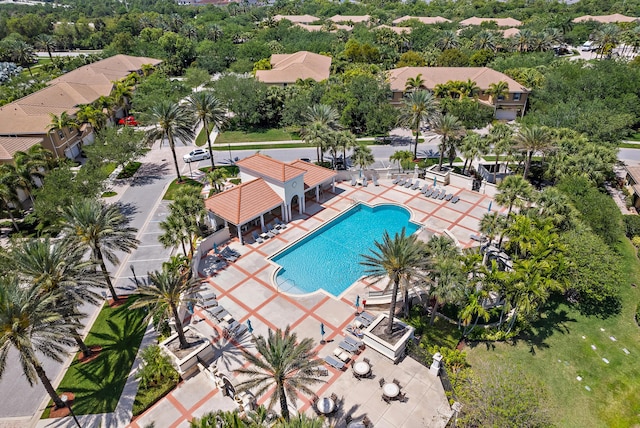4608 Cadiz Cir, Palm Beach Gardens, FL 33418 - community pool featuring a patio area and view of wooded area