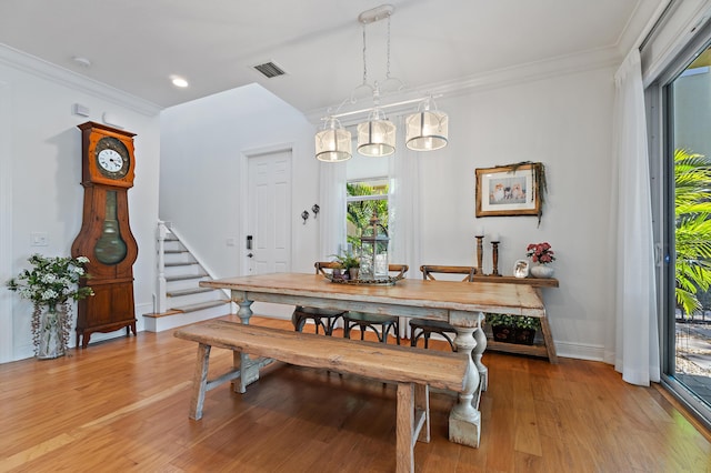 4608 Cadiz Cir, Palm Beach Gardens, FL 33418 - dining room with stairs, light wood finished floors, ornamental molding, baseboards, and recessed lighting
