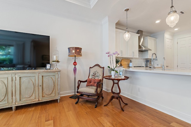 4608 Cadiz Cir, Palm Beach Gardens, FL 33418 - living area with light wood finished floors, ornamental molding, baseboards, and recessed lighting