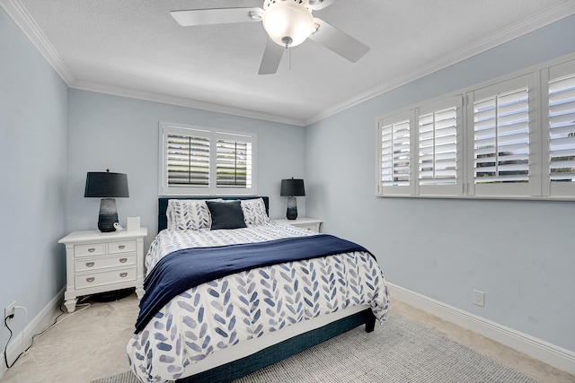bedroom with ornamental molding, baseboards, and ceiling fan