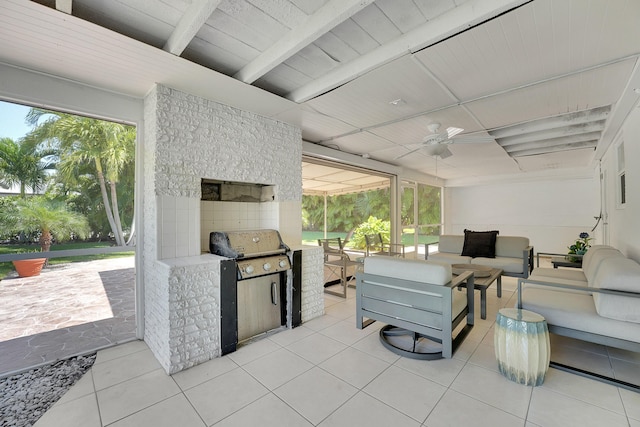 view of patio with an outdoor living space, area for grilling, and ceiling fan