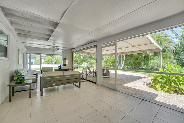 sunroom / solarium featuring an outdoor living space and plenty of natural light