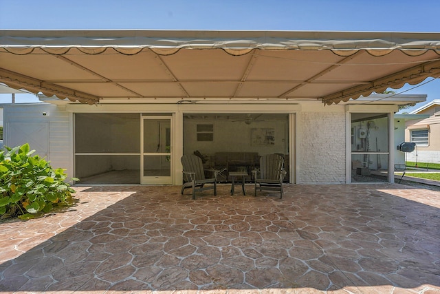 rear view of property with a patio area