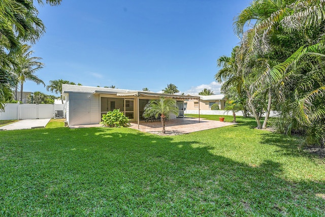 rear view of house featuring a patio