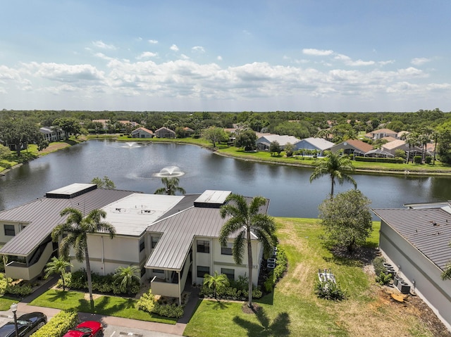 aerial view of residential area featuring a nearby body of water