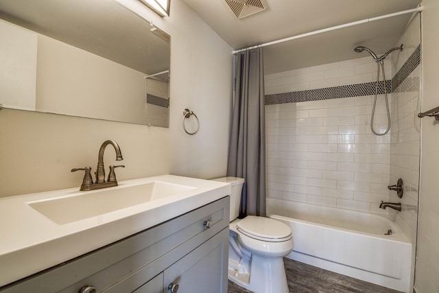 full bath featuring toilet, shower / bath combination with curtain, vanity, and wood finished floors