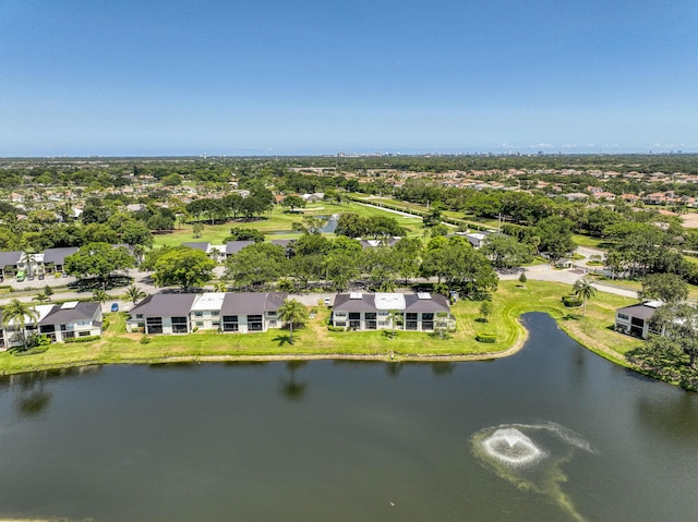 aerial perspective of suburban area with a nearby body of water