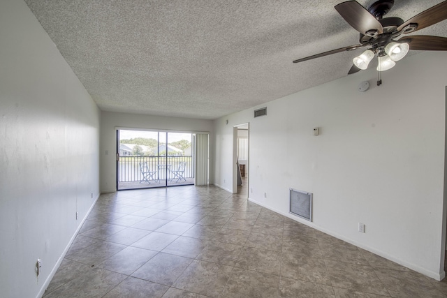 unfurnished room with a textured ceiling, baseboards, and ceiling fan
