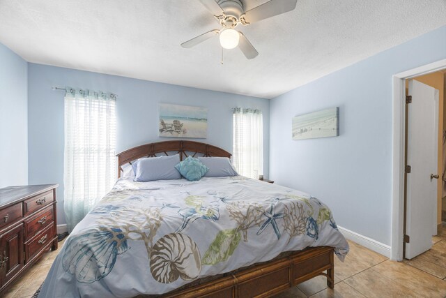 2442 SW Lafayette St, Port Saint Lucie, FL 34984 - bedroom with multiple windows, baseboards, and ceiling fan