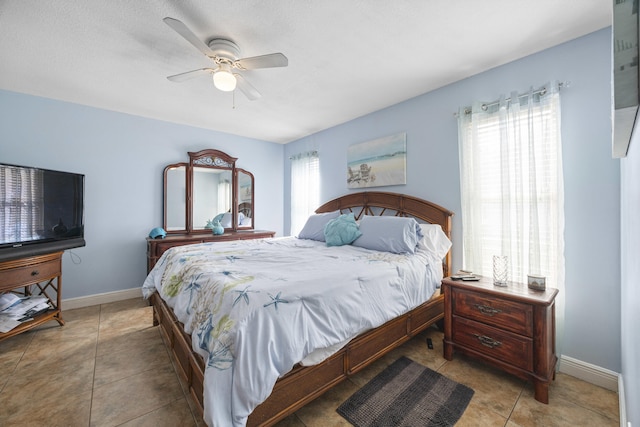2442 SW Lafayette St, Port Saint Lucie, FL 34984 - bedroom with multiple windows, tile patterned floors, and baseboards