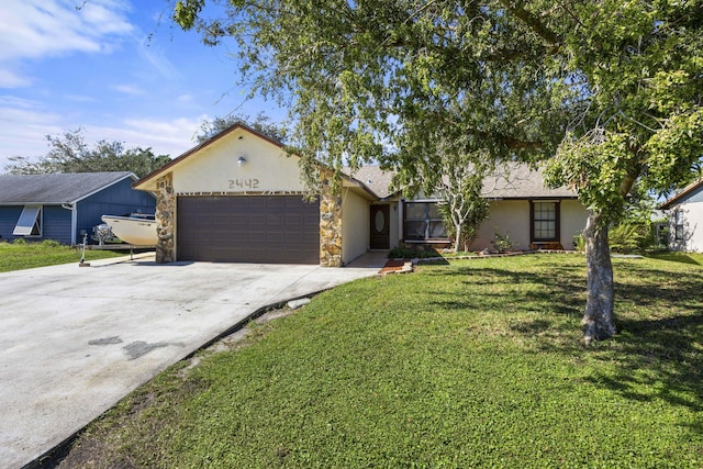 2442 SW Lafayette St, Port Saint Lucie, FL 34984 - view of front of home featuring an attached garage, stucco siding, concrete driveway, and a front yard