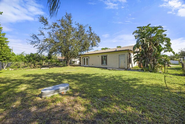 2442 SW Lafayette St, Port Saint Lucie, FL 34984 - view of yard with french doors