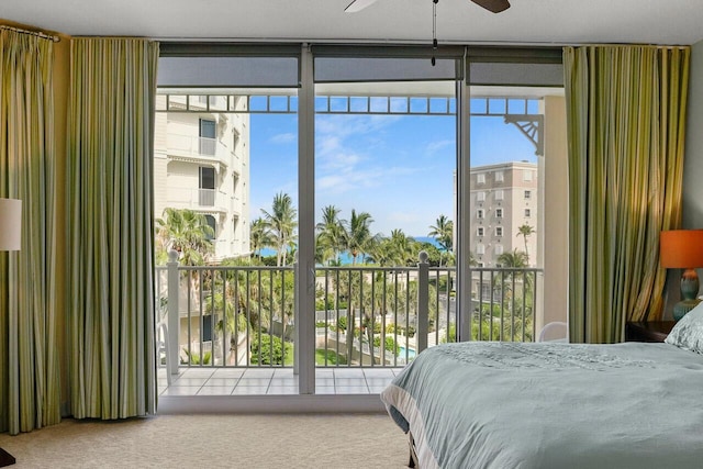 230 Ocean Grande Blvd Unit 501, Jupiter, FL 33477 - bedroom featuring carpet, access to exterior, and a wall of windows