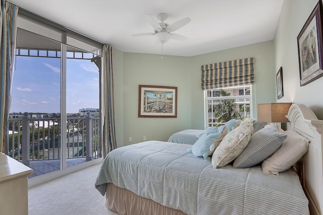 230 Ocean Grande Blvd Unit 501, Jupiter, FL 33477 - bedroom with access to exterior, carpet, and a ceiling fan
