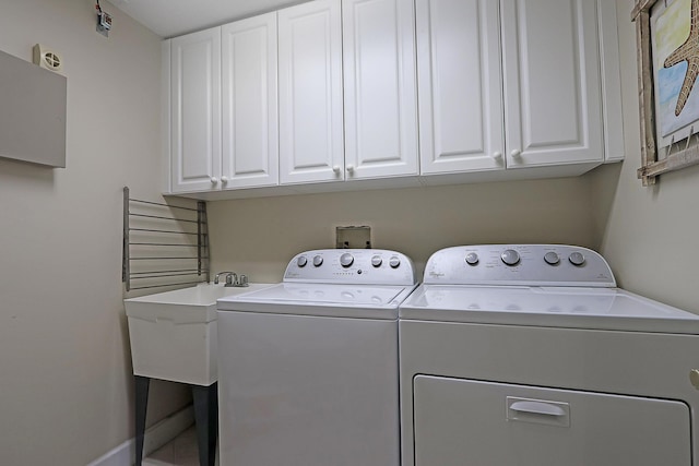230 Ocean Grande Blvd Unit 501, Jupiter, FL 33477 - washroom featuring washing machine and clothes dryer and cabinet space