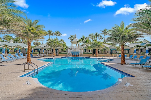 230 Ocean Grande Blvd Unit 501, Jupiter, FL 33477 - community pool featuring a patio area and a residential view