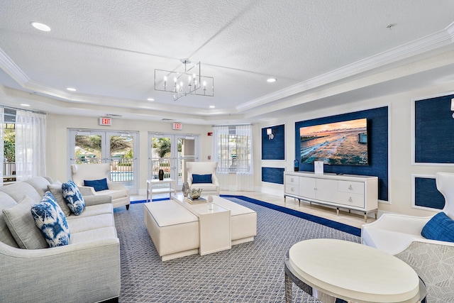 230 Ocean Grande Blvd Unit 501, Jupiter, FL 33477 - living area featuring a tray ceiling, ornamental molding, a chandelier, recessed lighting, and a textured ceiling