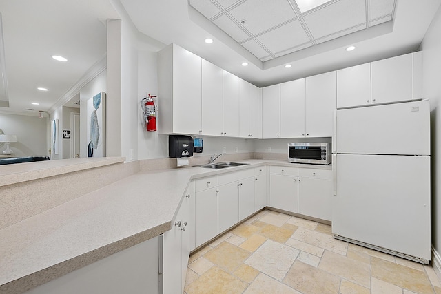 230 Ocean Grande Blvd Unit 501, Jupiter, FL 33477 - kitchen featuring freestanding refrigerator, stainless steel microwave, a sink, recessed lighting, and light countertops
