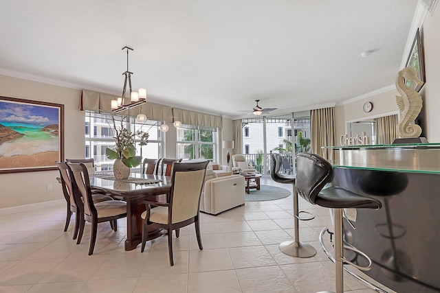 230 Ocean Grande Blvd Unit 501, Jupiter, FL 33477 - dining space featuring crown molding, a ceiling fan, a chandelier, light tile patterned floors, and baseboards
