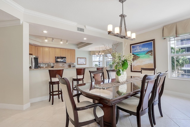 230 Ocean Grande Blvd Unit 501, Jupiter, FL 33477 - dining room featuring a chandelier, crown molding, plenty of natural light, baseboards, and a raised ceiling
