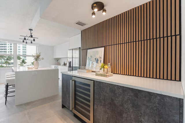 2800 E Sunrise Blvd Unit 4C, Fort Lauderdale, FL 33304 - bar with wine cooler and stainless steel fridge