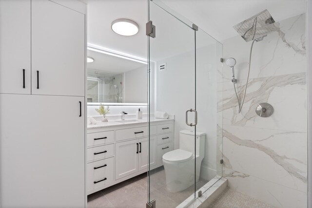 2800 E Sunrise Blvd Unit 4C, Fort Lauderdale, FL 33304 - bathroom featuring a marble finish shower, vanity, and toilet