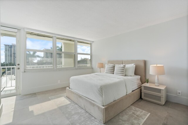 2800 E Sunrise Blvd Unit 4C, Fort Lauderdale, FL 33304 - bedroom featuring access to outside and baseboards