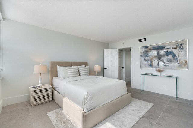 2800 E Sunrise Blvd Unit 4C, Fort Lauderdale, FL 33304 - bedroom featuring baseboards and light tile patterned floors