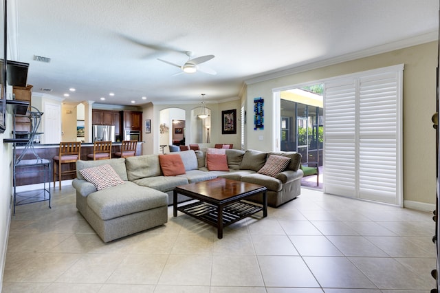 9413 Bristol Ridge Ct, West Palm Beach, FL 33411 - living area featuring ornamental molding, arched walkways, a ceiling fan, light tile patterned floors, and recessed lighting