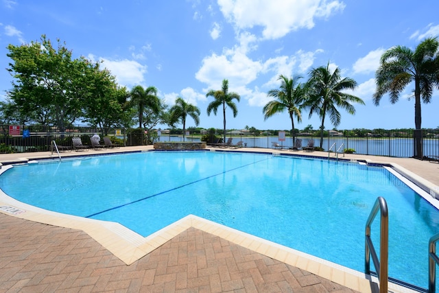 9413 Bristol Ridge Ct, West Palm Beach, FL 33411 - community pool featuring a patio and a water view