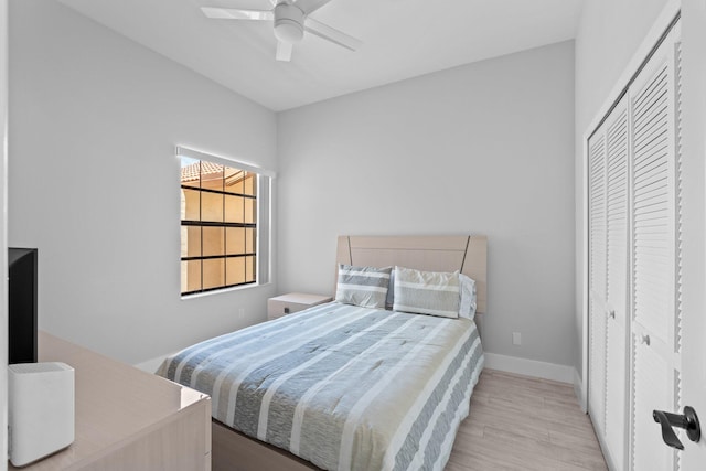 8316 Waterline Dr Unit 103, Boynton Beach, FL 33472 - bedroom with wood finished floors, a ceiling fan, a closet, and baseboards