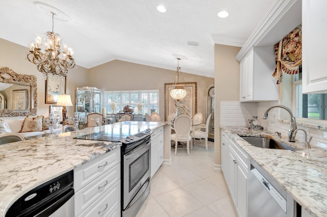 7780 Lake Champlain Ct, Delray Beach, FL 33446 - kitchen with stainless steel appliances, a sink, a chandelier, vaulted ceiling, and light stone countertops