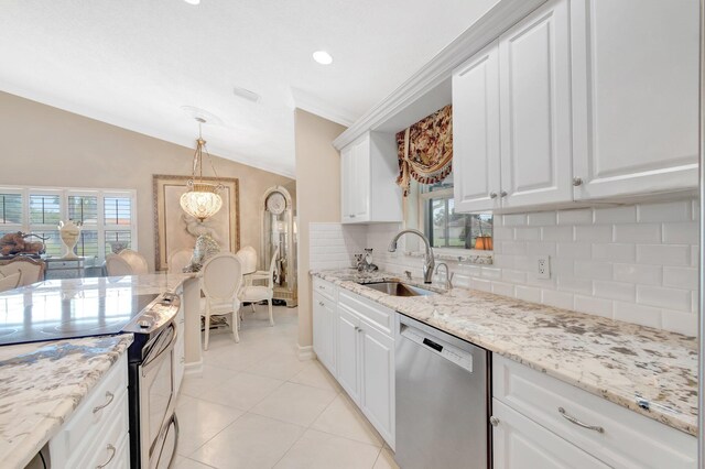 7780 Lake Champlain Ct, Delray Beach, FL 33446 - kitchen featuring appliances with stainless steel finishes, a sink, backsplash, lofted ceiling, and light tile patterned floors