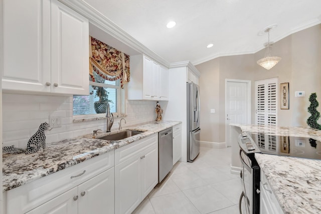 7780 Lake Champlain Ct, Delray Beach, FL 33446 - kitchen with stainless steel appliances, a sink, crown molding, white cabinetry, and baseboards